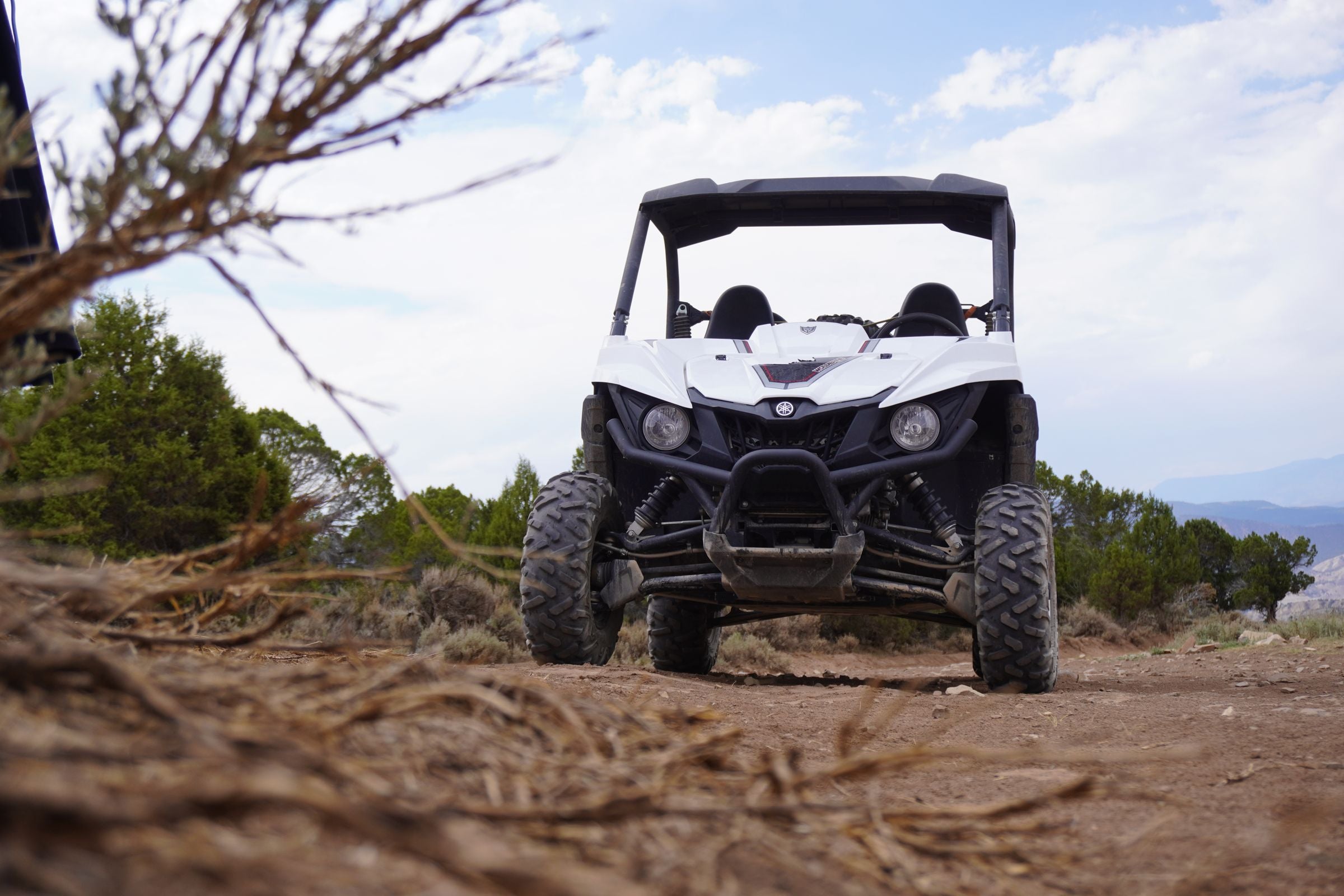 Side-by-side off-road vehicle on a dirt trail